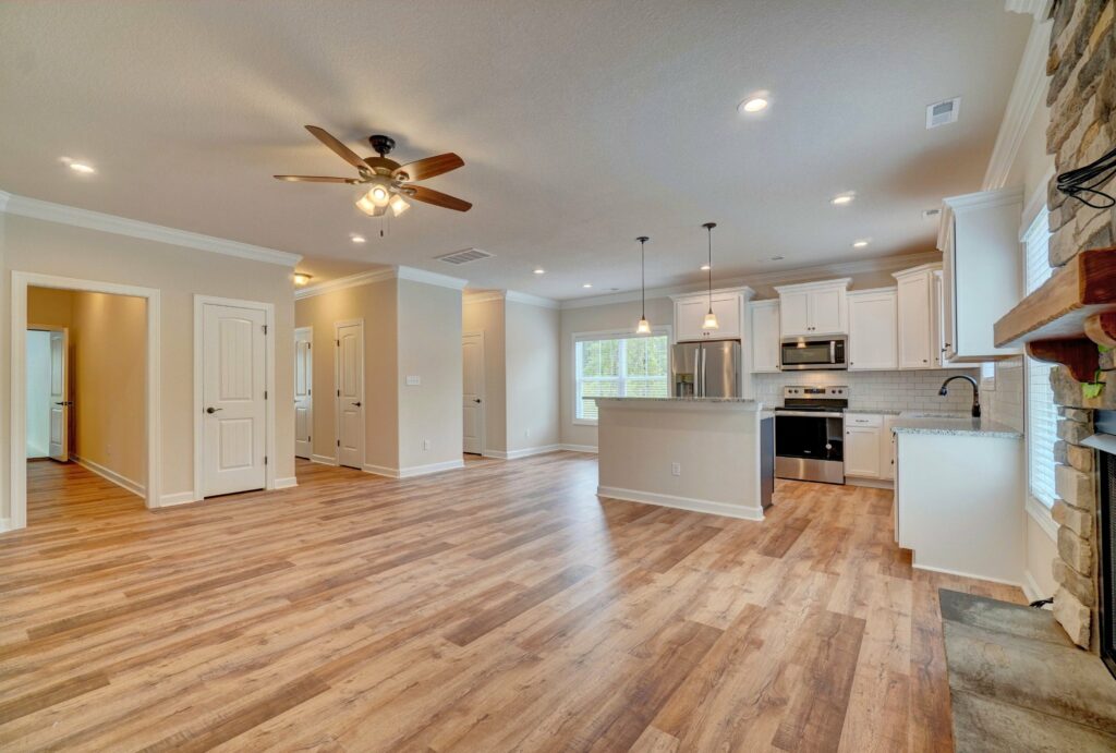 Home Builder in Southampton County. The Grayson Open Kitchen and Hallways from Living Room and Fireplace
